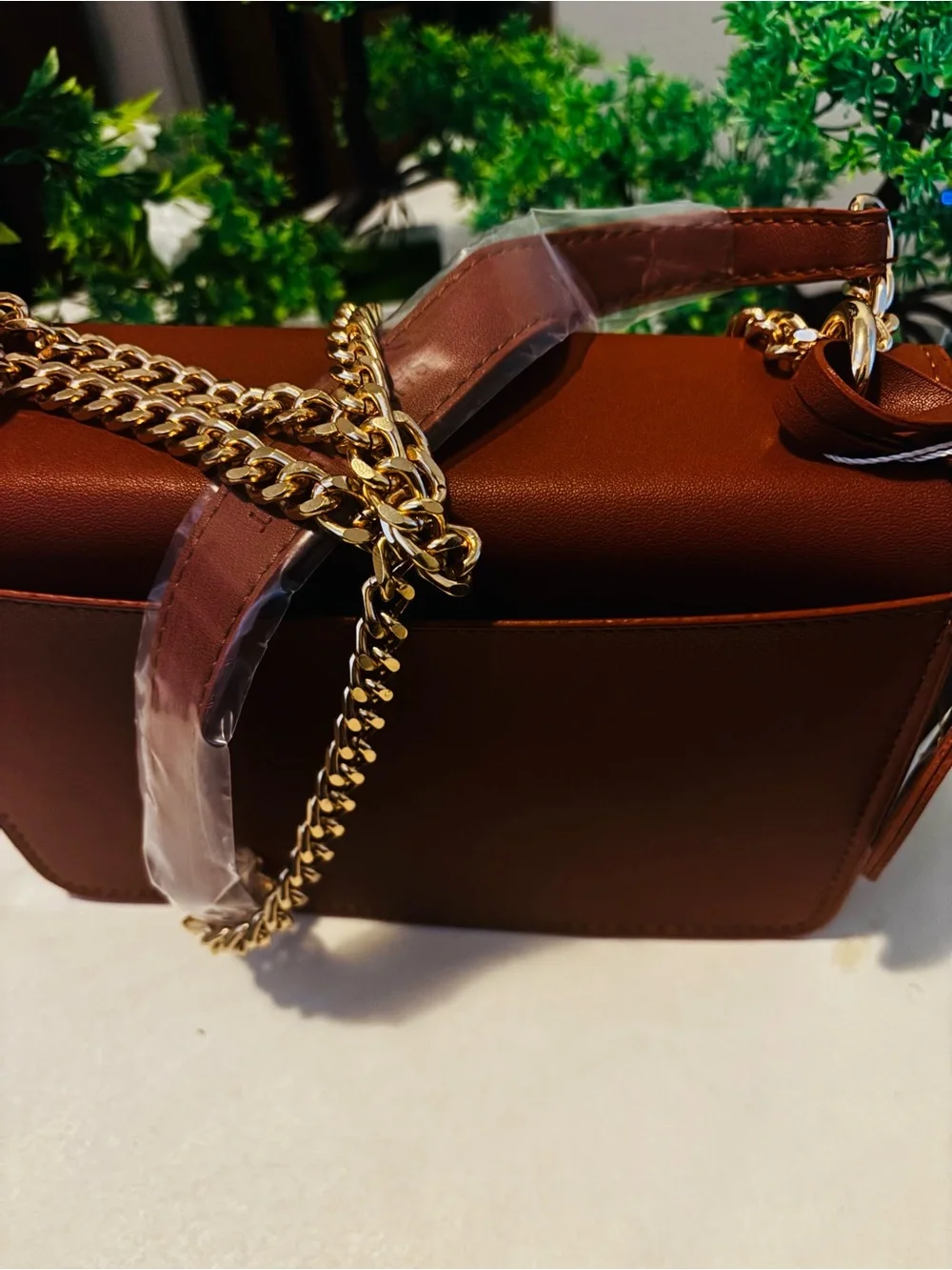 Sleek Brown crossbody bag with gold